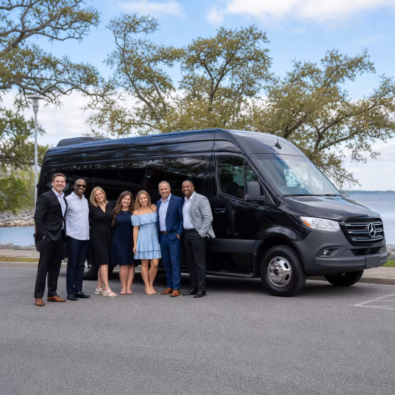 Group beside a Mercedes Sprinter limo from the Mobile fleet