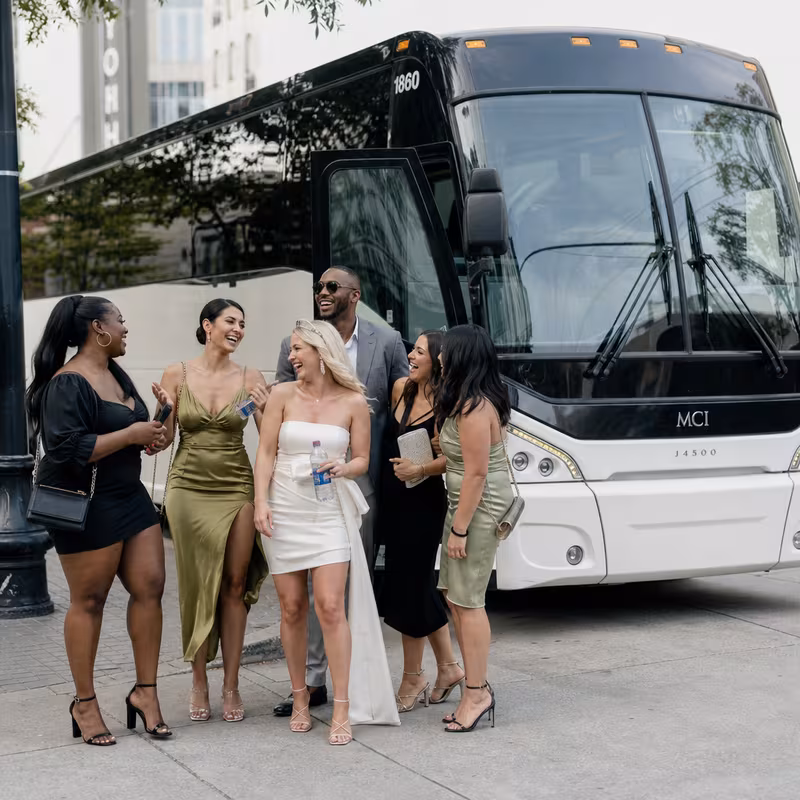 Passengers loading luggage while boarding an Mobile group shuttle