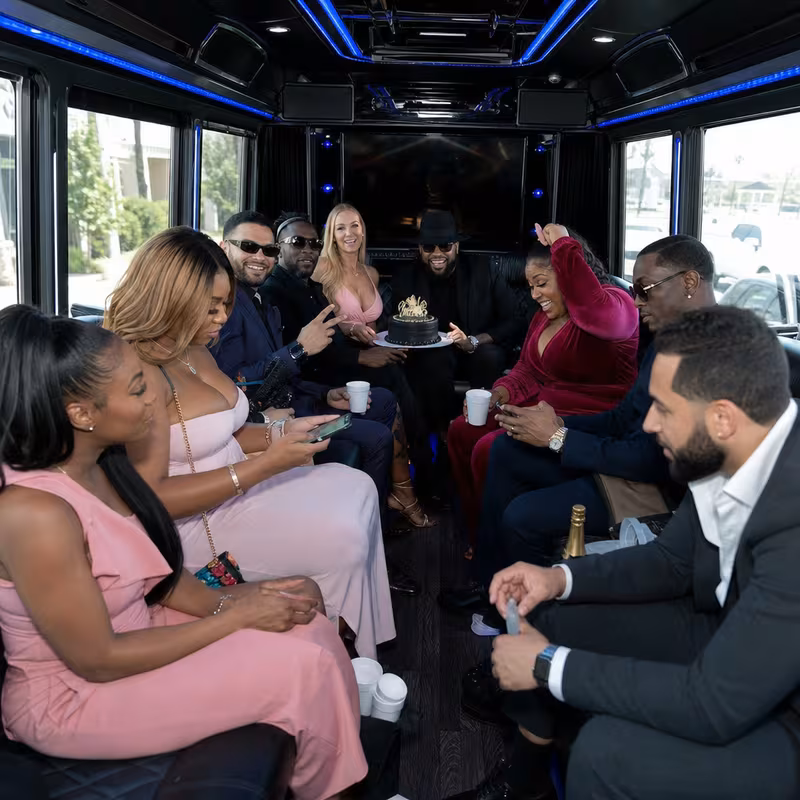 Black Mercedes Sprinter van staged for an Mobile Birthday Transportation group