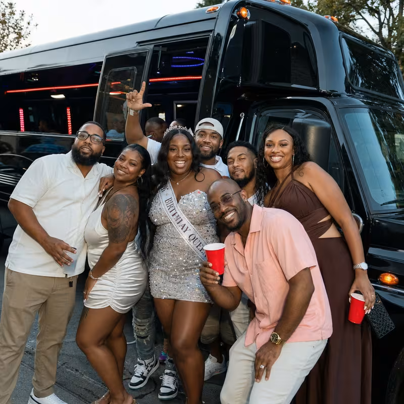 Party bus interior with wraparound leather seating and LED lighting in Mobile