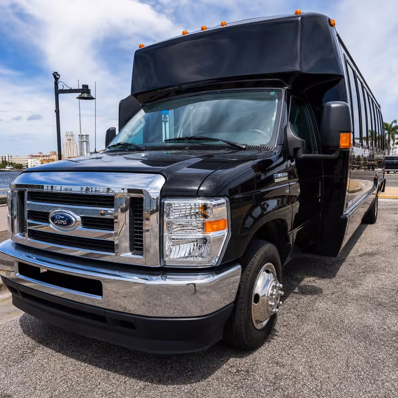 Party bus interior with wraparound leather seating and LED lighting in Mobile