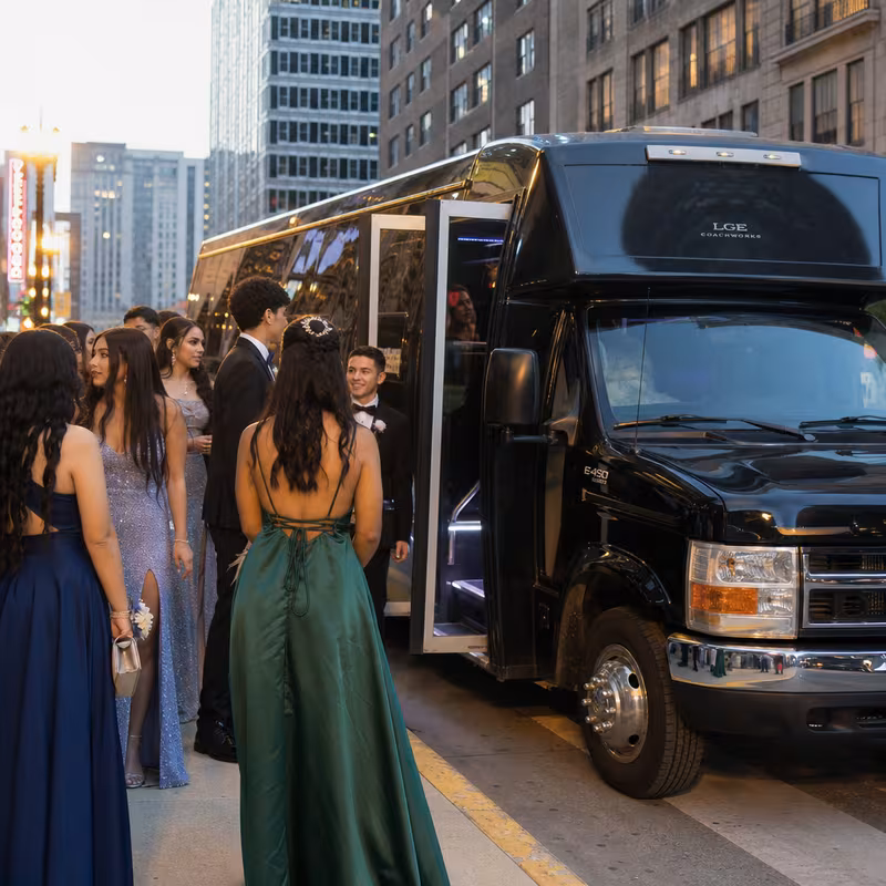 Passengers loading luggage while boarding an Mobile group shuttle