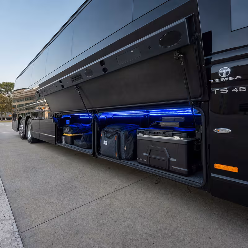 Party bus interior with wraparound leather seating and LED lighting in Mobile