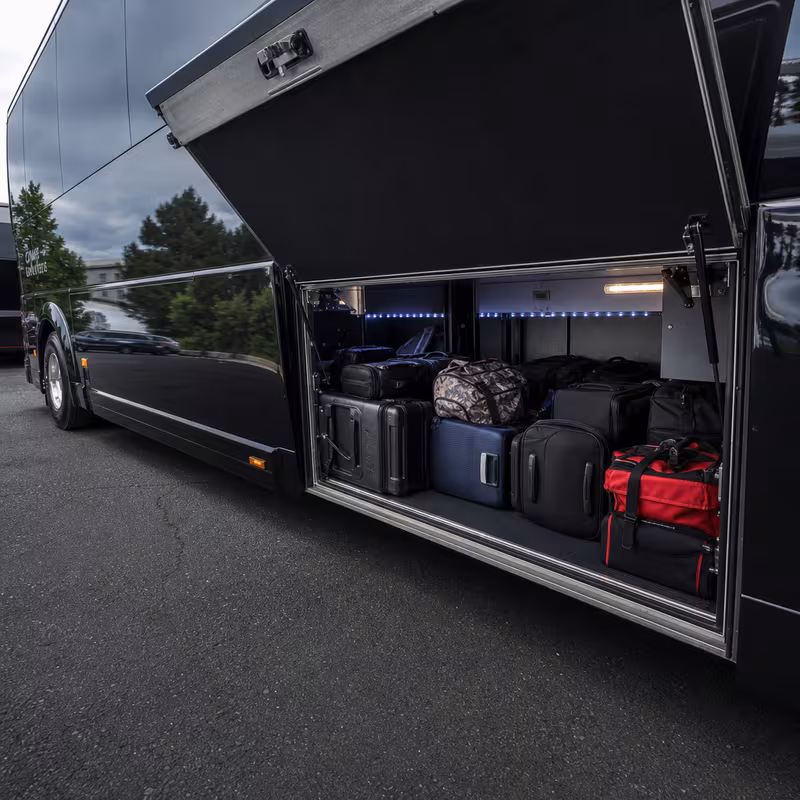Party bus interior with wraparound leather seating and LED lighting in Mobile