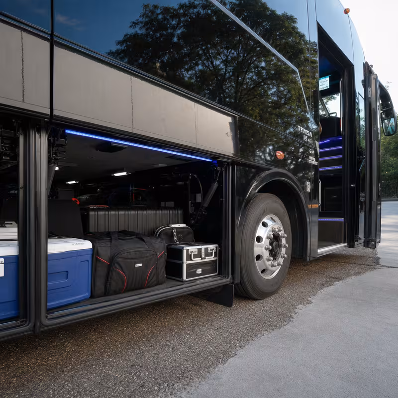 Party bus interior with wraparound leather seating and LED lighting in Mobile
